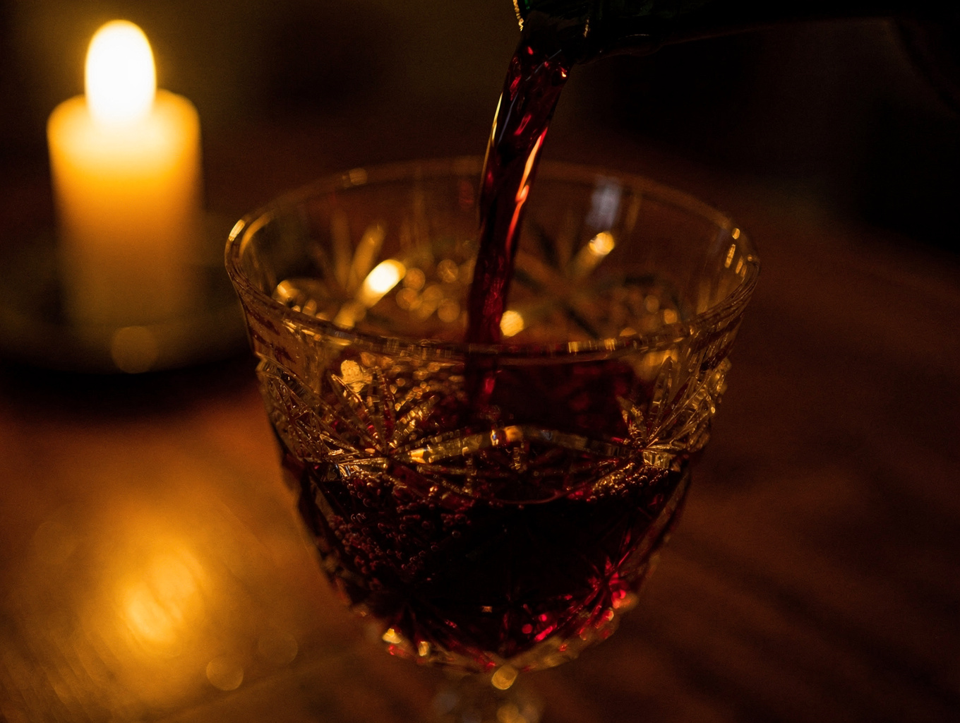 Deep red Amarone wine poured into a crystal glass